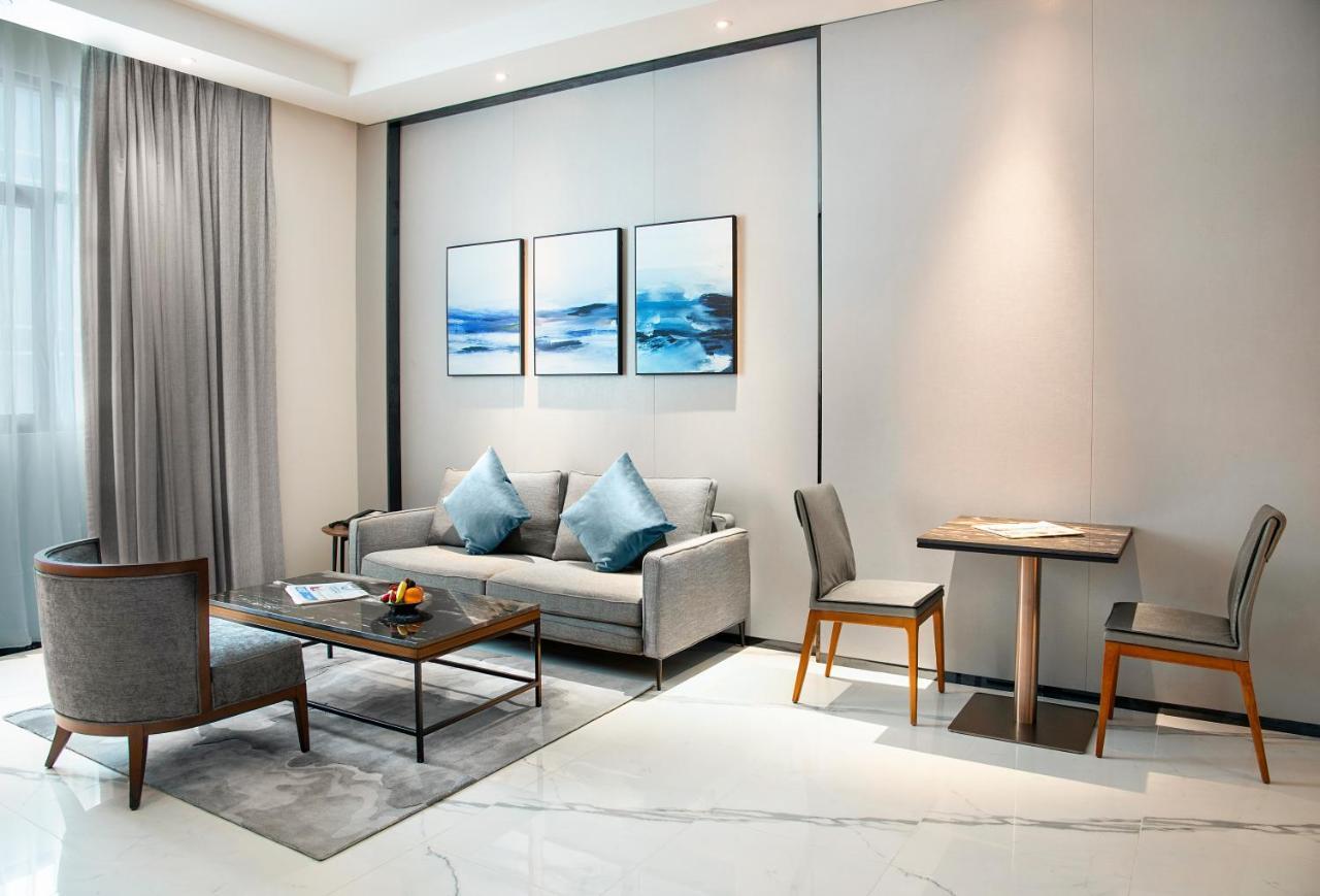 Asiana Grand Hotel Dubai Exterior foto A living room at the hotel