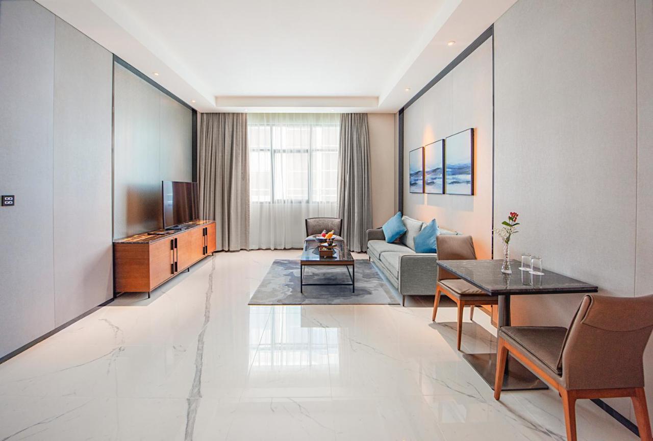 Asiana Grand Hotel Dubai Exterior foto A living room in a serviced apartment in Beijing, China